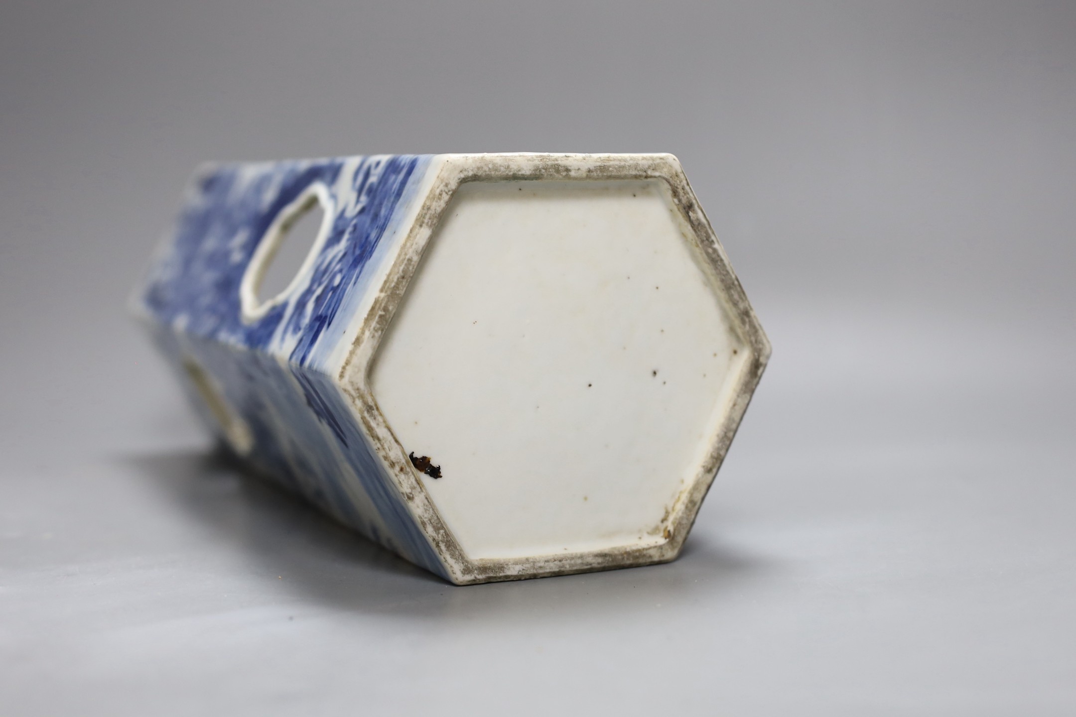 A Chinese blue and white hexagonal hat stand, late 19th century, 27.5 cms high, 27.2 cm high, hairline crack to one side of body